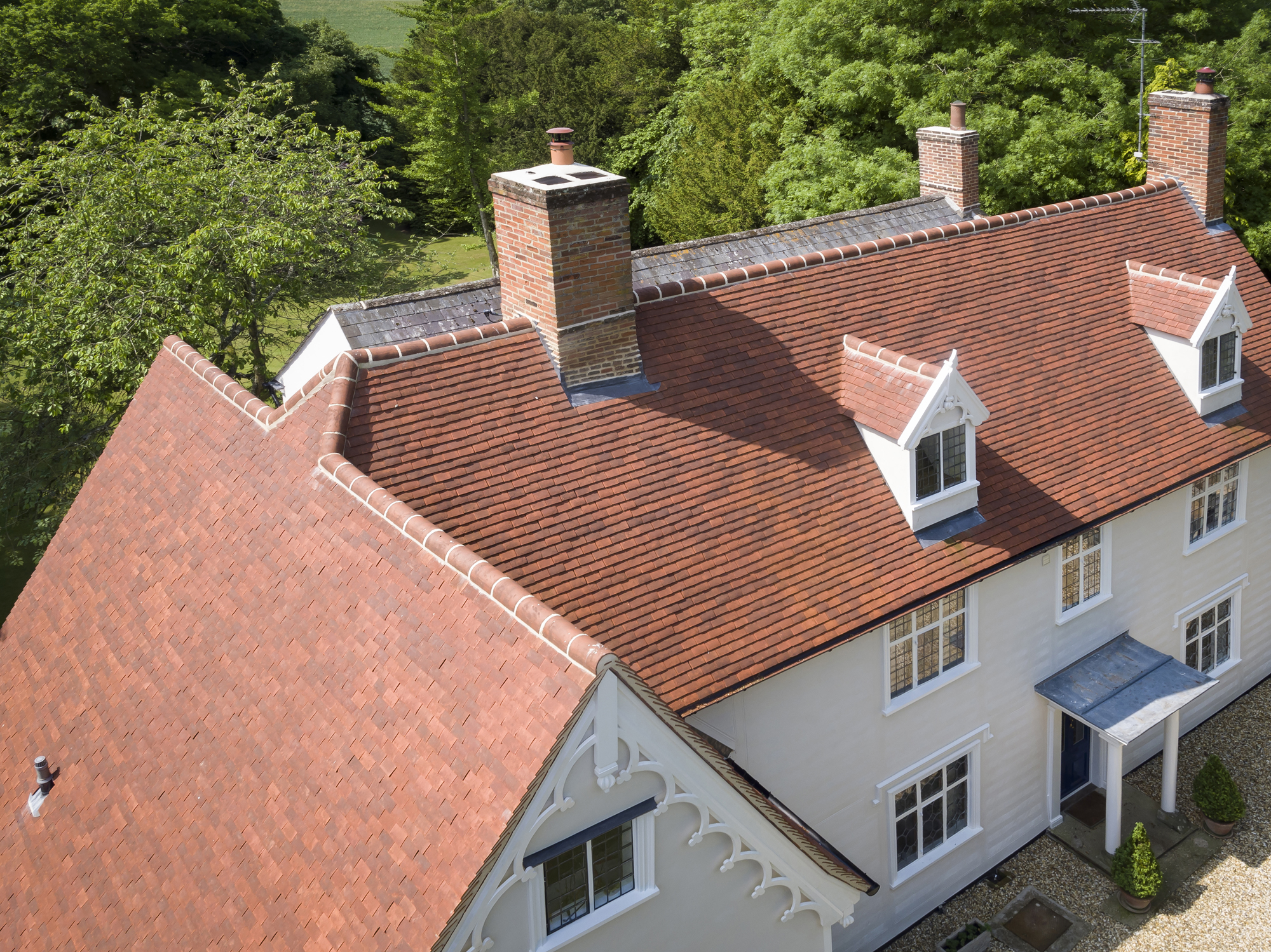 Pitched roof with clay tiles on an English cottage style house
