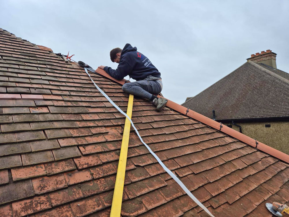 New ridge tiles on a UK residential house roof